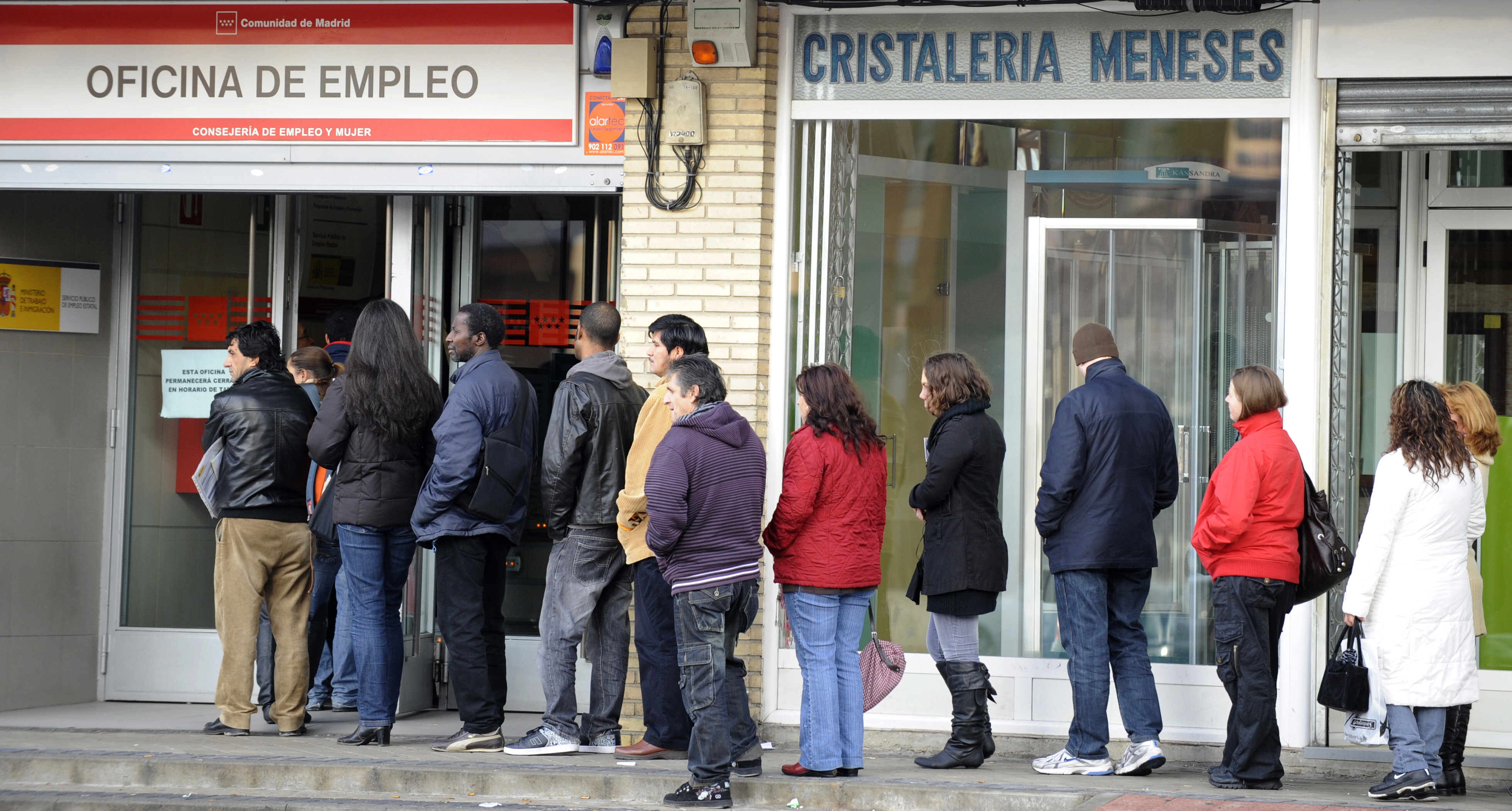 People wait in line at a government empl